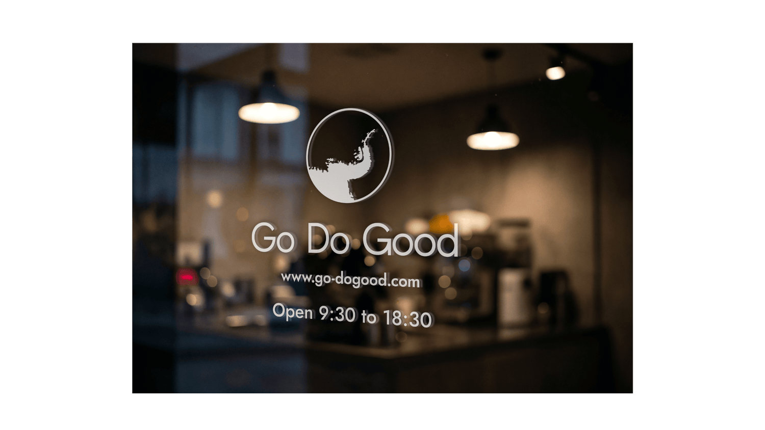 Blurred interior of a coffee shop with 'Go Do Good' logo and text.