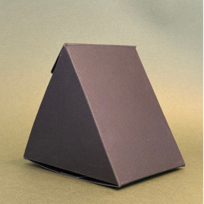 Brown pyramid-shaped object on a gradient background